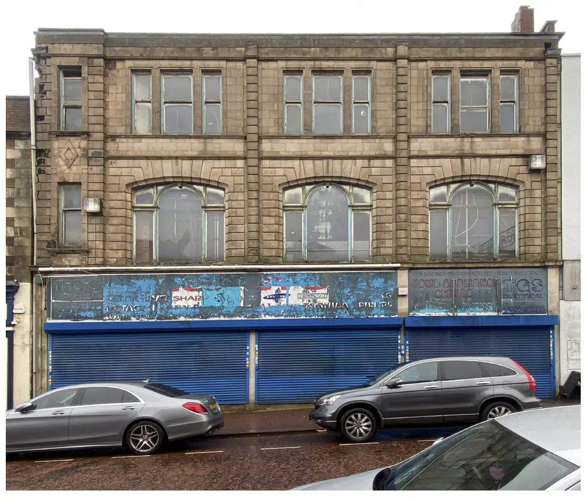 This building has been chosen due to the clear retrofit it has already undergone. The building has two halves, a modern function on street level with roller shutter doors. These doors seem very out of place as they are not shy in hiding their presence. Then the top half is traditional stone and mortar with some elements of detailing around the windows. I wonder what the addition would look like with the zero- carbon material repair pallet. - Ryan Cooksey Building 2 Photo.png